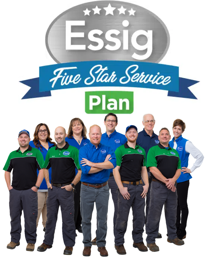 A Group Of Ten Essig Employees Stands In Front Of A Sign That Reads “Essig Five Star Service Plan.” The Team Is Wearing Branded Uniforms And Smiling At The Camera.